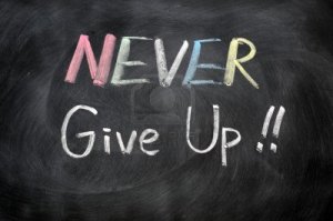 11939322-never-give-up-written-in-chalk-on-a-blackboard