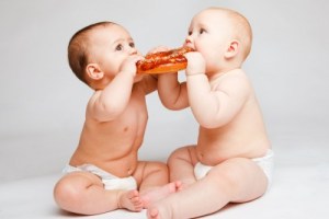 two-babies-eating